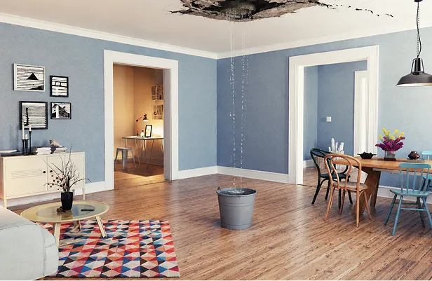 Living room with a damaged ceiling after a roof leak